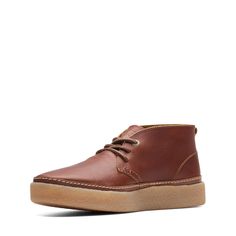 PRICES MAY VARY. Rubber sole No Heel Heel Height: 1.4 inches Brown Leather Footbed Sneakers, Brown Leather Footbed Sneakers For Everyday, Everyday Brown Sneakers With Leather Footbed, Leather Boots With Gum Sole And Plain Toe, Leather Boots With Gum Sole And Round Toe, Clarks Shoes Mens, Shoes Display, Desert Boot, Mid Boots