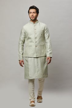 Cotton Linen blended kurta with floral ivory thread & gold sequence intertwined embroidered vest plus ivory churidar. The cotton-linen blend makes it one of our lightest and most breathable kurtas. Crafted with a collar neckline, full sleeves, and front button closure. Occasion: Can be worn to events like Sangeet, Mehendi, & Wedding WASH CARE INSTRUCTIONS - Please Dry clean only when it is applicable. Slight color variation is possible due to digital photography. Spring Chanderi Nehru Jacket With Resham Embroidery, Spring Nehru Jacket With Resham Embroidery In Chanderi, Spring Resham Embroidery Chanderi Nehru Jacket, Cotton Silk Bandhgala With Resham Embroidery For Spring, Spring Cotton Silk Bandhgala With Resham Embroidery, Spring Bandhgala Chanderi Straight Kurta, Spring Chanderi Bandhgala Straight Kurta, Spring Embroidered Cotton Silk Sherwani, Cotton Silk Nehru Jacket With Floral Embroidery For Diwali