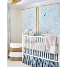 a baby's room with blue and white decor