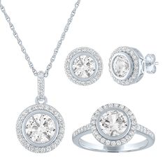 Dramatic with clean lines and radiant dazzle, this gemstone set features round lab-created white sapphire earrings with a matching pendant and ring. Each coordinated accessory features a lab-created white sapphire halo for graphic glam in sterling silver. Wear pieces separately or grouped for added impact. Our gift sets go the extra mile, made for sharing with someone special. Triple a surprise or treat yourself to a little sparkle. Modern Silver Jewelry With Halo Design, Modern Jewelry With Halo Setting For Anniversary, Modern Halo Setting Jewelry For Anniversary, Formal Jewelry With Halo Design And Round Stone, White Sterling Silver Jewelry Sets, Modern Diamond Jewelry With Halo Design, Round Lab Grown Diamond Jewelry With Halo, Round Lab-grown Diamond Jewelry With Halo, Lab Grown Diamond Halo Jewelry