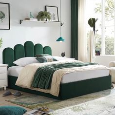 a bed with green headboard and foot board in a white room next to a window