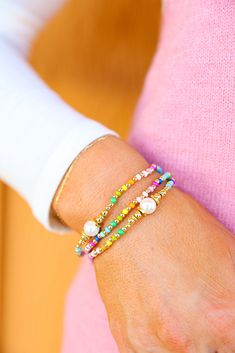 These stretch bracelets are so much fun to add to any bracelet stack! Featuring all the colors of the rainbow with gold accents + a pearl SOLD INDIVIDUALLY Adjustable Multicolor Bracelet With Pearl Charm, Pearl Gemstone, Colorful Bracelets, Gold Accents, Bracelet Stack, Bag Straps, Gemstone Bracelet, Earring Necklace, Stretch Bracelets