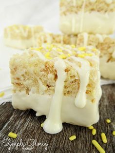 some kind of cake with icing and yellow sprinkles