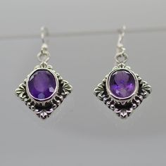 "Beautiful Faceted Purple Amethyst gemstones set on sterling silver earrings Material: Sterling Silver 925 Amethyst size: 9X10mm Stamped \"925\" Comes with jewelry box ready to ship" Purple Sterling Silver Earrings For Formal Occasions, Classic Sterling Silver Purple Earrings, Classic Purple Sterling Silver Earrings, Classic Purple Sterling Silver Gemstones, Purple Stamped 925 Earrings For Anniversary, Red Earrings, Dangling Earrings, Diamond Shaped, Amethyst Gemstone