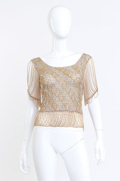 Loris Azzaro Metallic Crochet Knit Chain Drape Top front on mannequin @RECSS LA Elegant Short Sleeve Mesh Top For Evening, Chic Gold Short Sleeve Blouse, Gold Short Sleeve Top With Sequins, Gold Short Sleeve Tops With Sequins, Gold Sequined Short Sleeve Top, Gold Sequin Short Sleeve Top, Chic Embellished Gold Tops, Gold Embellished Summer Top, Gold Embellished Tops For Summer