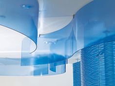 an artistic blue sculpture is hanging from the ceiling