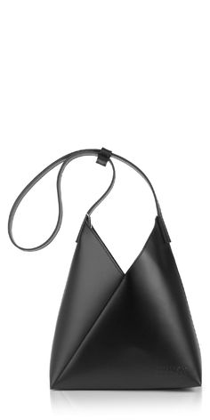 Introducing the Fortune Cookie Leather Shoulder Bag by MM6 Maison Margiela. This bag offers a modern twist on the iconic Japanese Triangle style. Crafted from soft black leather, it can be worn as a shoulder or top handle bag with its unique snap feature. Its fortune cookie-inspired design adds a playful touch to any outfit. Details: Color: Black 100% leather Magnetic snap closure Adjustable strap Interior slip pocket Vendor Code: SB6ZH0019P7183T8013 Leather Crossbody Bucket Bag With Magnetic Closure, Black Leather Hobo Bag With Magnetic Closure, Modern Leather Bucket Bag, Modern Leather Bucket Bag For Evening, Modern Leather Shoulder Bag For Evening, Modern Evening Hobo Crossbody Bag, Modern Leather Evening Shoulder Bag, Leather Bucket Bag With Magnetic Closure For Evening, Modern Leather Shoulder Bag With Magnetic Closure