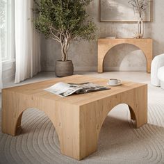 a living room with a coffee table and white couches