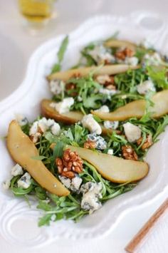 pears and goat cheese salad on a white plate