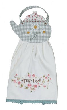 a white dress with flowers on it and the words tea time