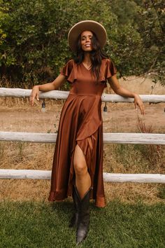 Make a statement in our stunning Callie Dress. This silky dress in brown features a v-neckline, back zipper, ruffle hem detail and twirl-worthy wrap skirt. Perfect for special occasions or everyday wear, this dress is sure to become your next Ivy favorite. Available in sizes xxs - 5x + kids! Fall Photoshoot, Silky Dress, Hello Fall, Satin Material, Hello Autumn, Autumn Inspiration, Fall Dresses, Wrap Skirt, Ruffle Hem