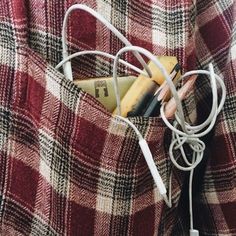 the cord is plugged into the pocket of a jacket