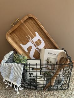 a basket with books and other items in it