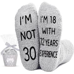 two socks with the words i'm not with twenty years experience printed on them