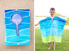 a young boy standing next to a towel on top of a grass covered field with a light bulb drawn on it