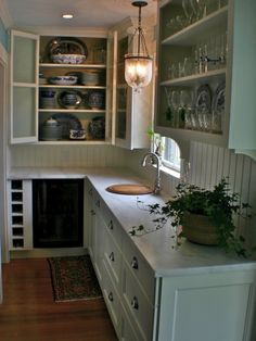 the kitchen is clean and ready to be used for dinner or wine tasting in someone's home