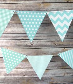 blue and white polka dot bunting banner on wooden planks with wood boards in the background