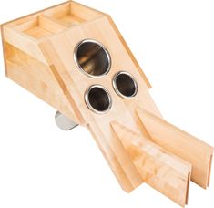 a wooden object with three holes in it