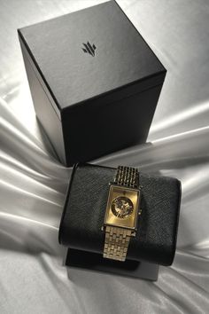 VIEREN Gold Sunray watch on black vegan leather watch stand and box set on white fabric Rectangular Watch, Swiss Automatic Watches, Watch Gift Box, Vday Gifts, Swiss Luxury, Watch Stand, Disco Era, Swiss Made Watches, Wrist Game