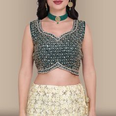 Sway into any party like a goddess in this gorgeous sequin work lehenga set! The lehenga is crafted from soft georgette fabric and is adorned with beautiful sequin work in a diamond pattern all over. The choli has matching diamond shaped sequin work embedded with diamond stone work, adding just the right amount of bling. The lehenga skirt has a contrast green border that adds a pop of color. Style this look with some statement jewelry and you're sure to make heads turn! Fabric for full length sl