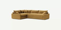 a tan couch with pillows on it