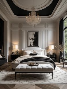 an elegant bedroom with black and white decor