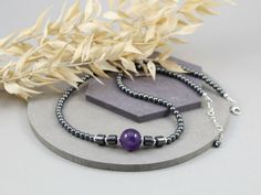 Statement Amethyst and Hematite Choker Necklace, 925 Sterling Silver.
Stunning 12mm purple Amethyst bead is beautifully finished off with 6mm barrel shaped and 4mm round Hematite beads and 925 Sterling Silver components, which gives the necklace very sparkly and unique look. The total length of the choker is around 17 inches (43cm) long, so it lays beautifully around your neck and it has an extra 1 inch (2.54cm) of dainty chain to adjust it perfectly just for you!
This gorgeous choker necklace is perfect for everyday and special occasions. It would make a gorgeous gift for her, Mother's Day gift, Christmas or Birthday Gift or maybe an unforgettable detail for your Boho chic wedding?
www.madamestore.etsy.com
#necklace #choker