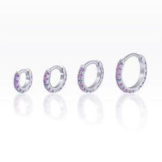 Purple Opal eternity Huggie ring -  huggie hoop - Rook - cartilage - helix - lobe earring Listing : single - Material : Sterling silver casting - AAA Purple opal gems - 18 gauge, 5,6,8,10mm diameter available suitable for Rook/helix/cartilage/lobe/tragus piercing Huggie stye :  A hinge is located at the top of the earring that allows the post to open and close without an earring back. Or if you have any question please feel free to send me convo before place an order =) Unique piece and easy to Silver Halo Huggie Earrings, Silver Huggie Septum Ring, Huge Rings, Silver Casting, Purple Opal, Dagger Earrings, Country Jewelry, Tiny Bow, Tragus Piercing