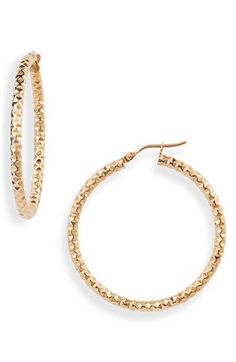 A faceted design allows light to reflect from every angle of these large, textured hoops handcrafted in 14-karat gold. 1 1/2" drop; 1/8" width Snap-post closure Handcrafted 14k gold Made in Italy 14k Gold Hammered Hoop Earrings, Elegant Hammered Round Hoop Earrings, Elegant Hammered Hoop Earrings, Textured 14k Yellow Gold Jewelry, Elegant Gold Faceted Hoop Earrings, Textured Gold Jewelry For Anniversary, Elegant Textured Jewelry For Anniversary, Hammered Yellow Gold Hoop Earrings, Small Hammered Hoop Earrings For Formal Occasions