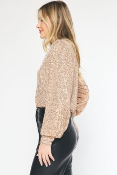 Bring in the New Year in style. Our Sequin Long Sleeve V-Neck Bodysuit is the perfect piece to make you stand out at any NYE event! Pair with our leather shorts and some tall boots for a look that is sassy & chic! You'll surely shine bright from day to night! Item Description: Sequin Long Sleeves V-neckline Bodysuit Snap Button Closure at Bust Lined Woven Non-sheer Lightweight Color: Champagne Fabric Content: 100% Polyeter Brand: Entro **Clearance - Final Sale Actual product colors may vary from Fall Party V-neck Bodysuit, Chic Bodysuit For Night Out In Fall, Chic Fall Bodysuit For Night Out, Chic Winter Party Bodysuit, Chic Party Bodysuit For Fall, Chic Bodysuit For Fall Party, Chic Fall Party Bodysuit, Winter Party Bodysuit With V-neck, Champagne Fabric