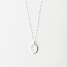 Our most popular oval pendant, without personalization. Choose a smooth, or hand-hammered texture. Everyday Hammered Oval Jewelry, Everyday Oval Hammered Jewelry, Hammered Sterling Silver Oval Jewelry, Silver Hammered Oval Pendant Necklace, Silver Hammered Oval Pendant Jewelry, Oval Hammered Sterling Silver Jewelry, Hammered Oval Jewelry As A Gift, Minimalist Hammered Oval Pendant Jewelry, Oval Hammered Necklace As Gift