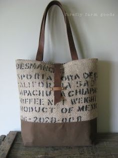 a brown and white bag sitting on top of a wooden table next to a wall