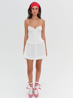 Embrace the spirit of European summer with the Marlowe white mini dressa cotton eyelet dress with underwire cups, corset detailing, and a drop waist silhouette for a touch of vintage charm. This little white dress, adorned with eyelet lace and a loop trim, is the ultimate go-to for sun-drenched days that turn to dinners on the terrazza. White Slip Dress, Little White Dress, Mini Dress White, Lemon Dress, Ivory Dresses, White Slip, Mini Slip Dress, Eyelet Dress, White Dresses