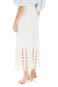 Stella McCartney cropped cotton pants with a wide, flared cut, decorated with cutwork embroidery and scalloped hem. The style is finished with two horizontal front pockets, belt loops, zip fly with concealed hooks, and pressed crease. The model is 177 cm tall and wears a size XS. Size Info IT Color Detail White Made In Bulgaria Material 100%CO Season One spring Season Two summer Product clothing Brand Stella McCartney Size And Fit Embroidered Hem, Stella Mc, Cutwork Embroidery, Dress Watch, Scalloped Hem, Cut Work, Chic Woman, Cotton Pants, Roberto Cavalli