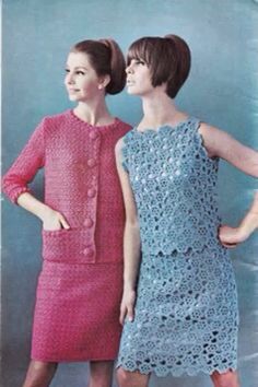 two women standing next to each other in front of a blue background wearing matching dresses