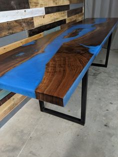 a wooden table with blue paint on it