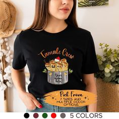 Embrace the spirit of  Latino Christmas with our Tis the Season for Tamales T-shirt and sweatshirt, a must-have for anyone who adores the crisp, cozy days of winter. Find more Christmas apparel and accessories here in our store!  SEE THE SIZE CHART MEASUREMENTS FOR ALL ITEMS Bella Canvas Unisex T-shirt. *Our relaxed fit tee (Bella + Canvas) is a unisex style that runs a touch small for men, and about half a size large for women. It's a relaxed fit and is soft and cozy. Heavy Blend Hoodie: Unisex Tamale Making Shirts, Tamale Apron Ideas, Latino Christmas, Spanish Christmas, Mexican Shirts, Christmas Apparel, Mexican Christmas, Unisex Style, Tis The Season