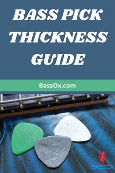 Bass picks laying on top a 4-string bass guitar Guitar For Beginners, Music Theory, Guitar Chords, Guitar Lessons, Guitar Pick