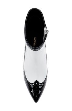 Brogue perforations and wingtip styling add a retro aesthetic on a luxe leather bootie balanced by a pointy toe and tapered heel. 3" heel 5" shaft Side zip closure Memory foam cushioning Leather upper, lining and sole Imported Chic Wingtip Heels With Brogue Detailing, Luxury White Heeled Boots For Formal Occasions, Elegant Wingtip Boots With Reinforced Heel, Fitted Pointed Toe Heels With Brogue Detailing, Fitted Heels With Brogue Detailing And Pointed Toe, Elegant High Heel Boots With Brogue Detailing, Elegant Perforated Pointed Toe Heels, Elegant Pointed Toe Heels With Perforations, Elegant White Heeled Boots For Formal Occasions