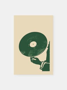 a hand holding a record on top of a green and beige paper with an image of a