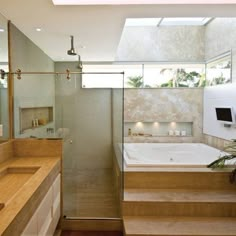 a bathroom with a bathtub, sink and mirror