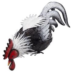 a white and black rooster with red beaks on its head is flying through the air