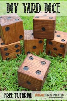 wooden dices sitting in the grass with text overlay that says diy yard dice