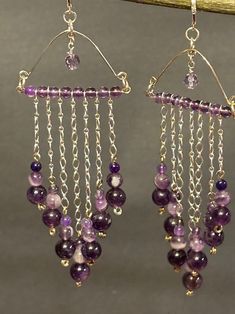 These are one of kind beautiful handmade dangle chandelier earrings with purple Amethyst and a lavender faceted Crystal dangling from the center.  4 mm 6 mm 8 mm round purple amethyst with Sterling silver chain cascading on the chain into a v shape with stacked beads large on the bottom medium and small. This is an amazing production dangling.  Closing with sterling silver LeverBacks. Total measurement 5 inches long including sterling silver lever back earring wire. Noted these earrings are heav Chandelier Earrings Diy, Handmade Chandelier, Lavender Earrings, Crystal Chandelier Earrings, Handmade Crystal Jewelry, Jewelry Making Earrings, Amethyst Jewelry, Amethyst Gemstone, Amethyst Crystal