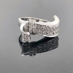 Weight:13.1gr Metal:18kt white gold and platinum Stones:Diamonds *Cut:Old mine *Carat weight:1.60ct approximately *Colour:H/I *Clarity:VS/Si Condition:Very Good Hallmarks: French, eagle and dog's heads Comments: This Art Deco ribbon ring, from the 1930s, is set with old mine cut diamonds. There is an approximate total carat weight of 1.60ct. The ring is made in 18kt white gold and platinum since it is marked with the French eagle and dog's heads. It is in very good vintage condition. Ring Size:5 Art Deco Platinum Jewelry With Pave Setting, Formal Art Deco Diamond Ring With Pave Setting, Art Deco White Gold Ring With Pave Setting, Vintage White Gold Rings With Pave Setting, Art Deco White Gold Rings With Pave Setting, Art Deco White Gold Diamond Ring In Platinum, Art Deco Silver Diamond Ring With Polished Finish, Silver Art Deco Diamond Ring With Polished Finish, Art Deco White Gold Diamond Ring With Polished Finish