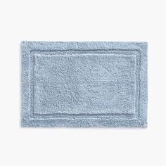 a light blue bath mat on a white background