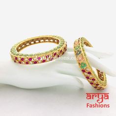 2.6 size Mint Green Meenakari Kundan Bangles with CZ and Ruby Stones Features: Made in Brass with 22 Karat Gold polish Pair of 2 Bangles Thickness: Approx. 0.5 Inches Available in size 2.6 Kundan Kada, Kada Bangles, Traditional Wedding Jewellery, Ruby Bangles, Kundan Bangles, Bangles Indian, Bridal Bangles, Stone Feature, Indian Wedding Jewelry