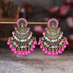 Brand New Peacock Decor Drop Jhumka Earrings Material - Alloy With Good Quality Color - Multicolor Style - Dangle Eardrop Height - 2.6” Eardrop Width - 2” Care Instruction : Avoid Heat & Chemicals Like Perfume, Deo, Alcohol Etc. Clean With Dry Cotton Cloth. Pack In Air Tight Container After Use. Peacock Design Dangle Chandelier Earrings, Pink Bollywood Jewelry, Pink Bollywood Chandelier Earrings As Gift, Bollywood Style Pink Chandelier Earrings As Gift, Pink Bollywood Drop Earrings, Bollywood Style Pink Dangle Earrings, Pink Bollywood Style Drop Earrings, Elegant Pink Jewelry With Peacock Design, Festive Pink Dangle Jewelry