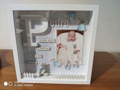 a photo frame with a baby in it