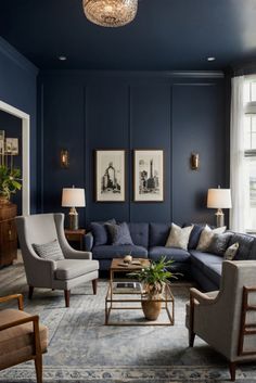 a living room with blue walls and furniture in the center, along with pictures on the wall